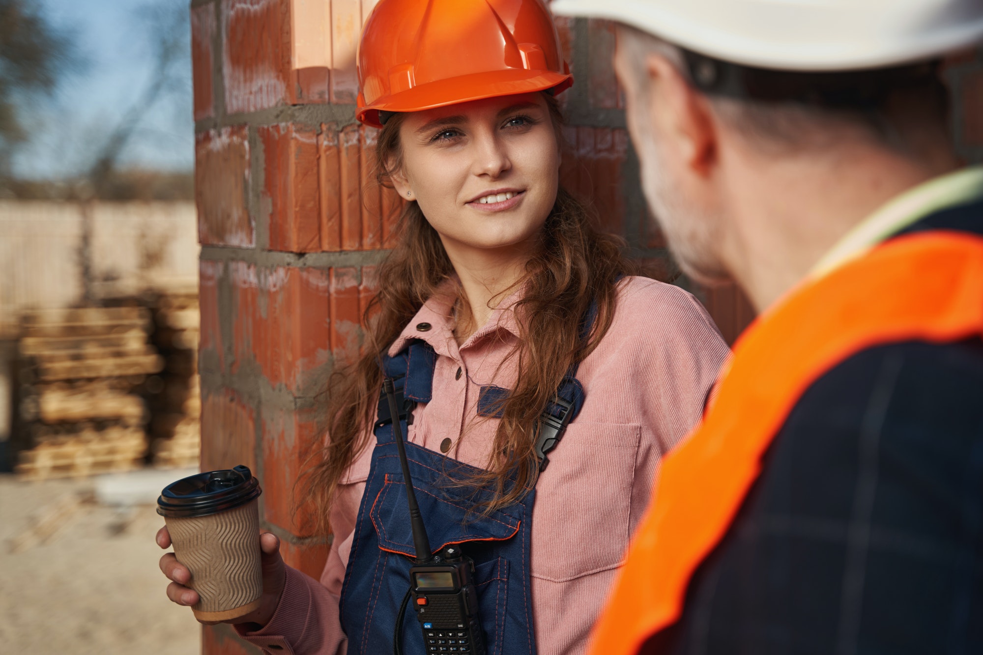 Certified builders having a conversation during coffee break