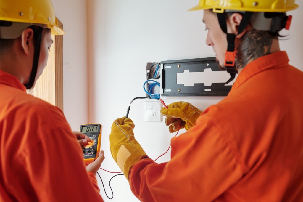 Electricians Testing Electrical Wires